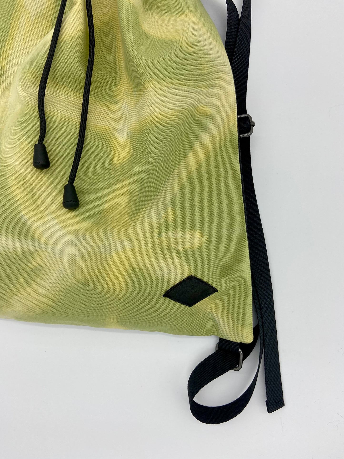 green drawstring backpack