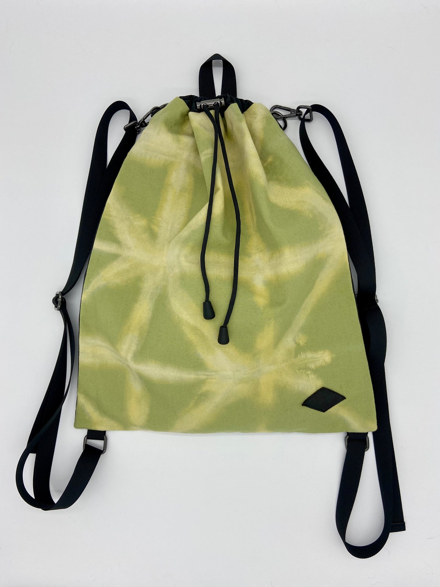 green drawstring backpack